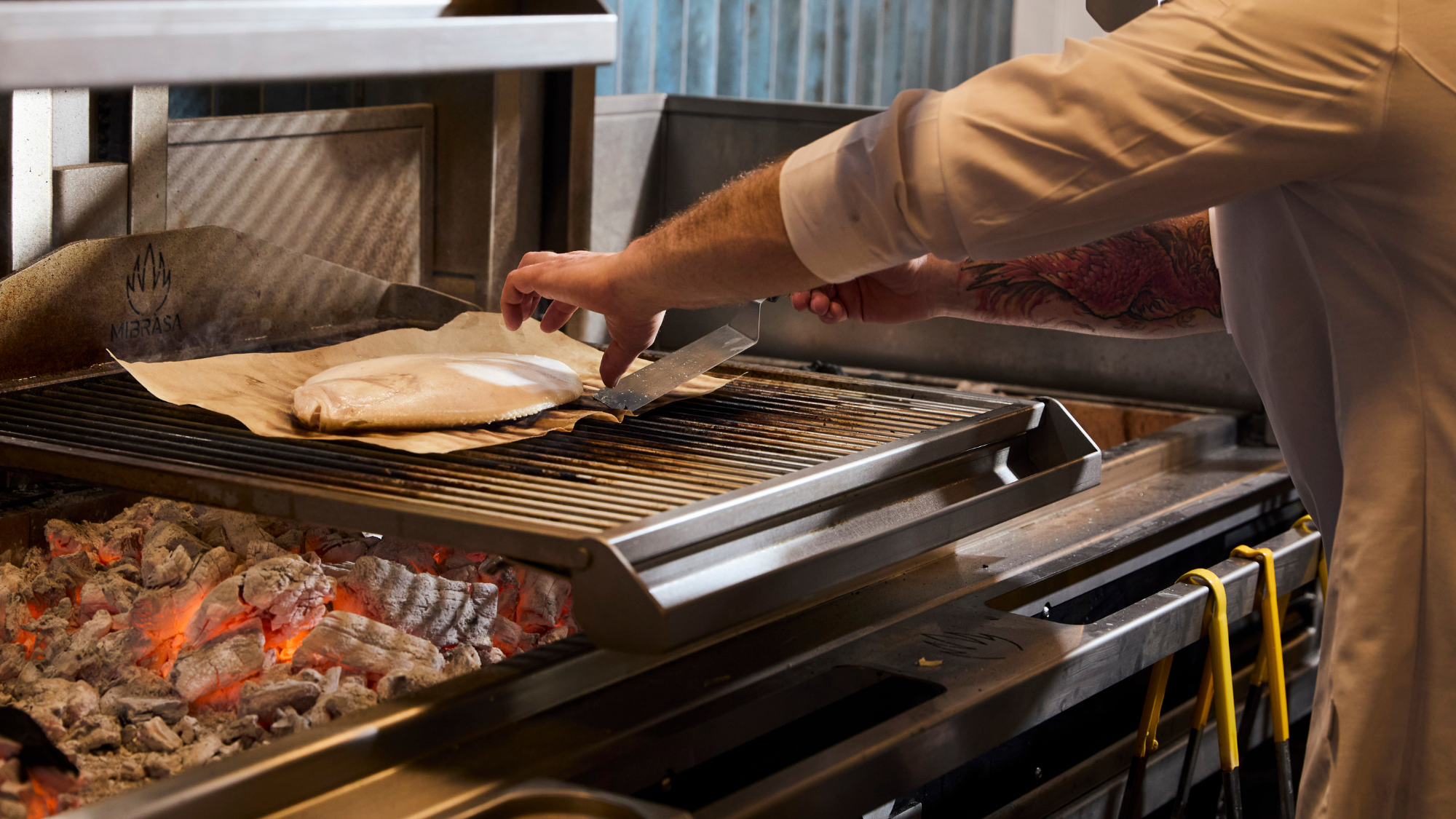 Chef David cooking St Mawes fish on hearth